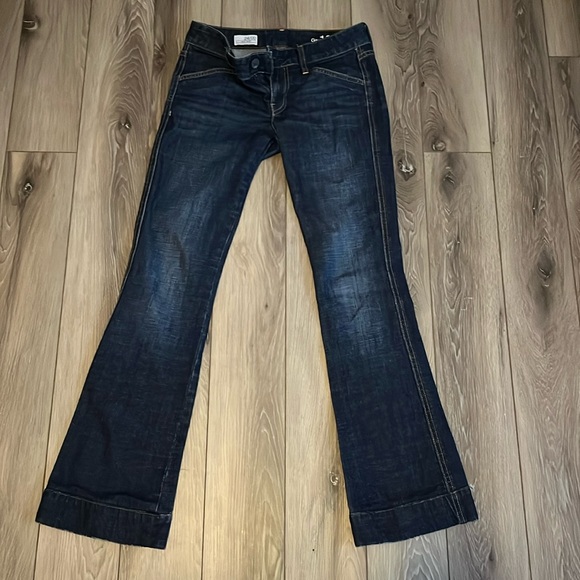 Dark wash low rise Gap 1969 bootcut jeans with flared leg. - Picture 2 of 4